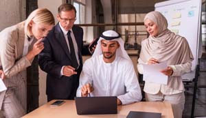 Multiethnic corporate business team meeting in the office for a strategic marketing plan - Office workers, entrepreneurs and company employee at work in a multinational company